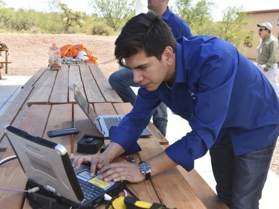 at a computer in the field